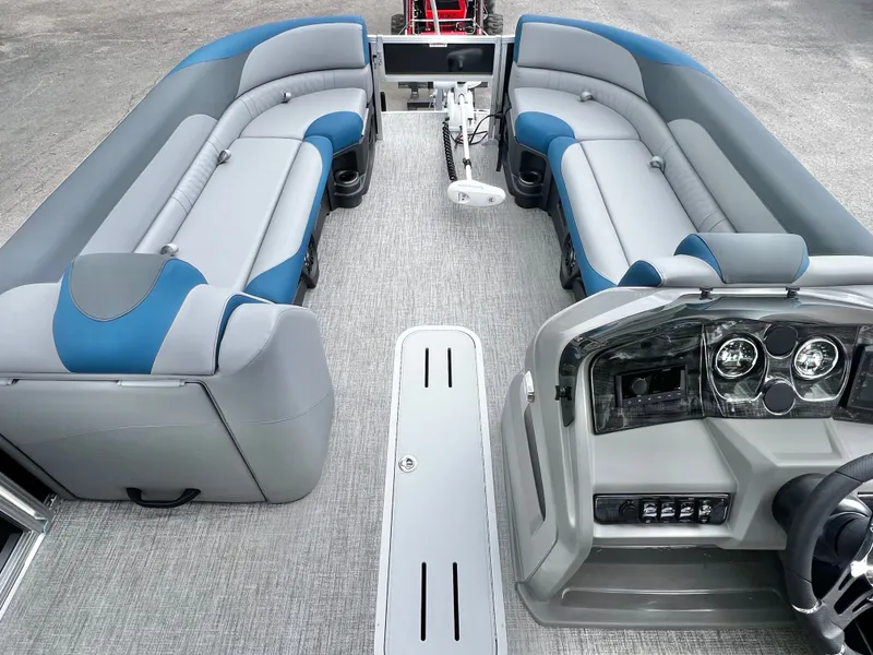Slide: The Image of Interior of 2026 Avalon LSZ 23' Cruise Triple-Toon, luxurious seating and helm console. - 23