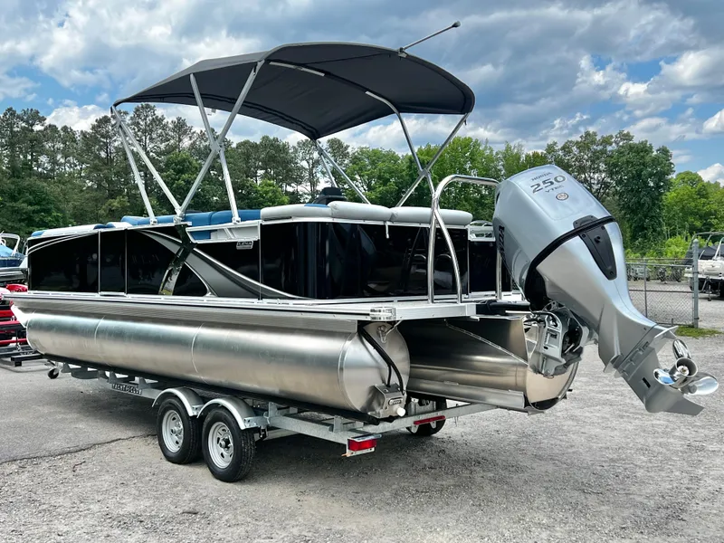 Slide: The Image of 2026 Avalon LSZ 23' Cruise Triple-Toon pontoon boat, silver, on trailer. - 3