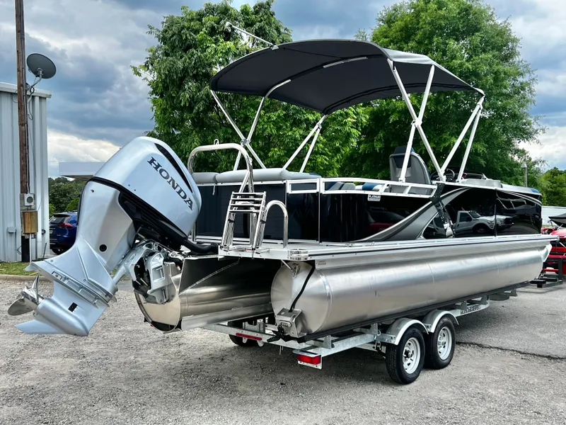 Slide: The Image of 2026 Avalon LSZ 23' Cruise Triple-Toon with Honda engine, on trailer. - 5