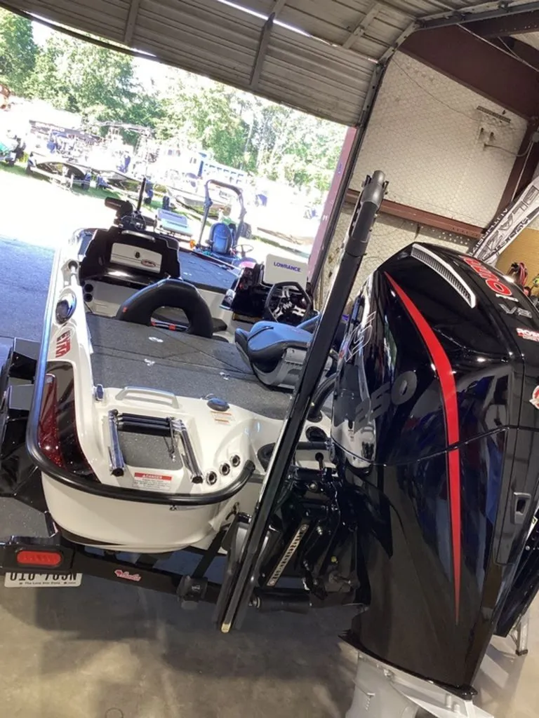 Slide: The Image of 2025 Bass Cat Eyra boat parked in a garage. - 3