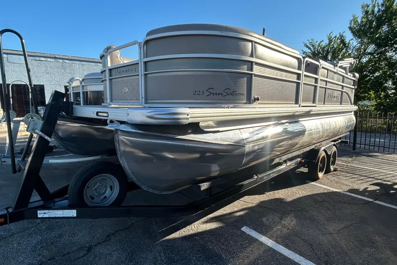 The Image of 2008 Premier Marine SunSation 225 LTD pontoon boat on trailer in parking lot. - 0