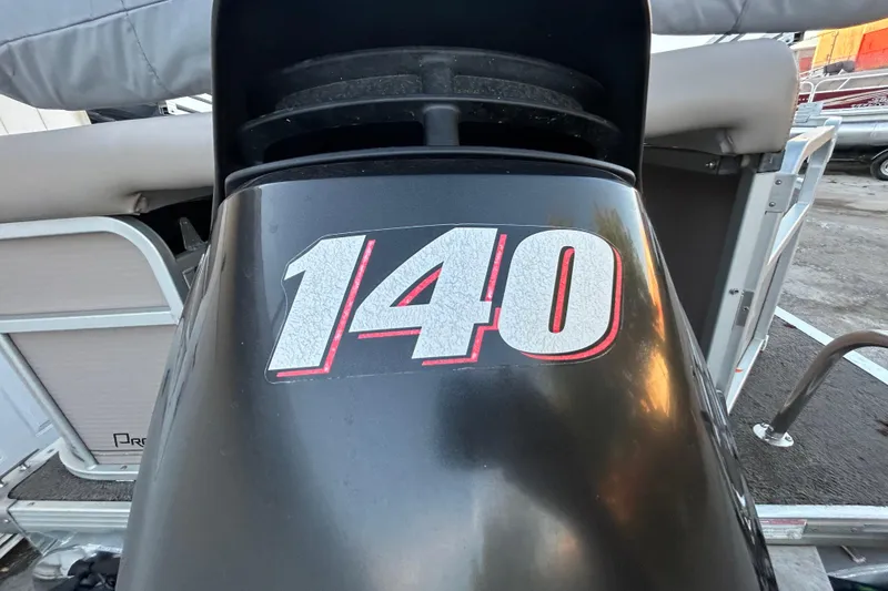 Slide: The Image of 2008 Premier Sunsation 225 LTD boat with "140" decal on motor. - 1