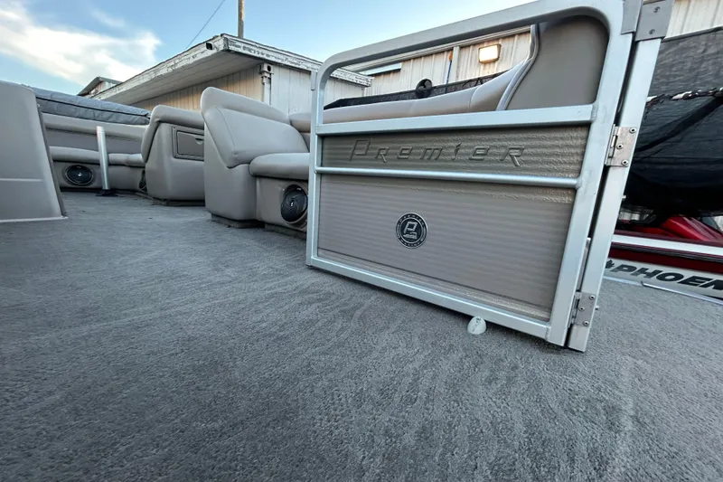 Slide: The Image of 2008 Premier Sunsation 225 LTD boat interior with plush seating and carpeted flooring. - 10