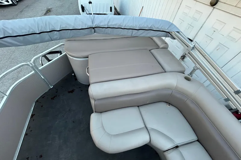Slide: The Image of 2008 Premier Sunsation 225 LTD pontoon boat with beige seating and protective cover. - 11