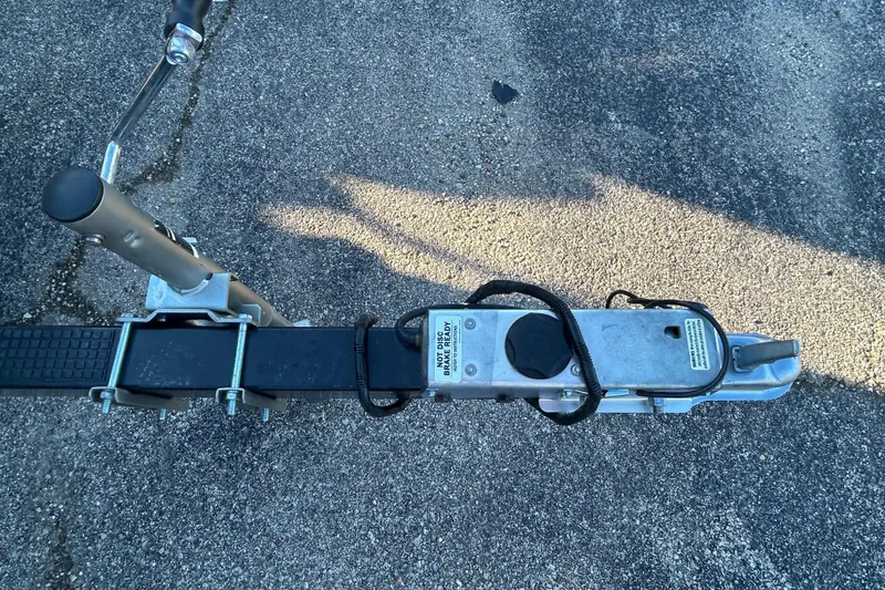 Slide: The Image of Trailer hitch of a 2008 Premier Marine SunSation 225 LTD on asphalt surface. - 12