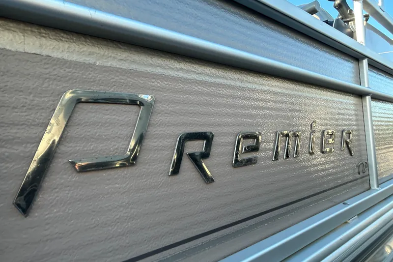Slide: The Image of 2008 Premier Marine SunSation 225 LTD boat logo close-up. - 13