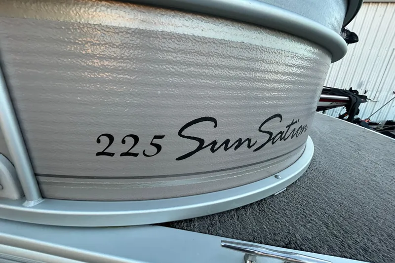 Slide: The Image of 2008 Premier Sunsation 225 LTD boat detail with logo and textured surface. - 15