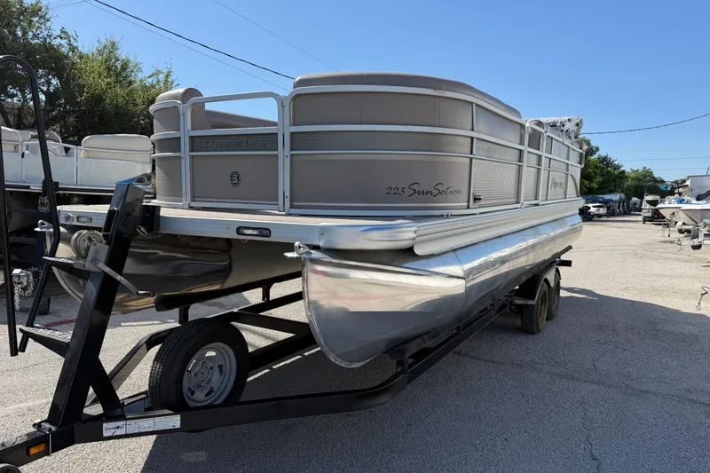 The Image of 2008 Premier Sunsation 225 LTD pontoon boat on trailer, parked outdoors. - 16