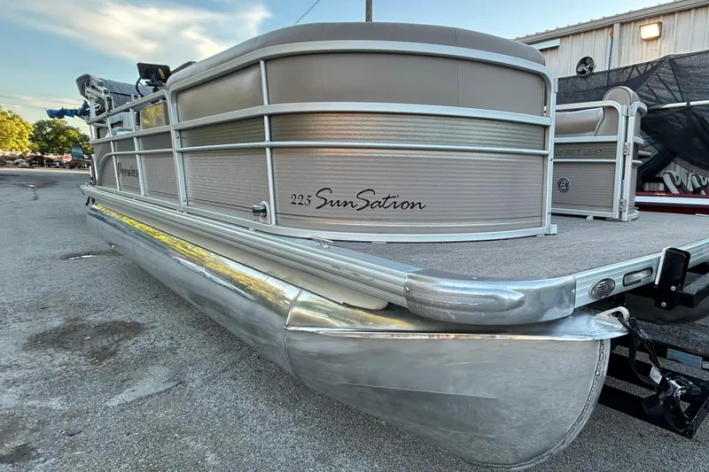 Slide: The Image of 2008 Premier Sunsation 225 LTD pontoon boat parked outdoors. - 4