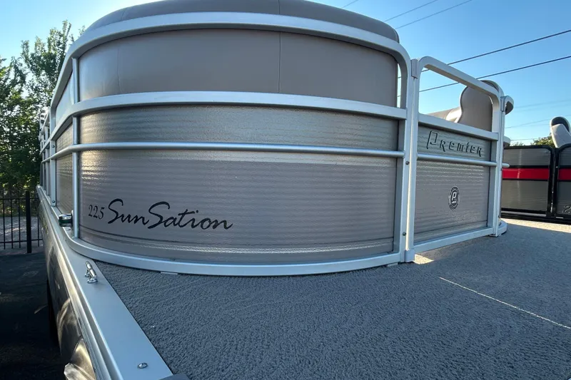 Slide: The Image of 2008 Premier Marine SunSation 225 LTD pontoon boat, side view with branding details. - 6
