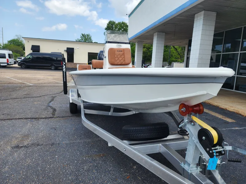 Slide: The Image of 2026 Avid 19 FSX boat on trailer outside building. - 5