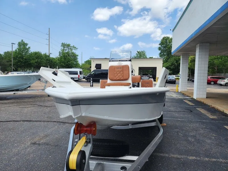 Slide: The Image of Avid 19 FSX 2026 boat on trailer outdoors. - 6