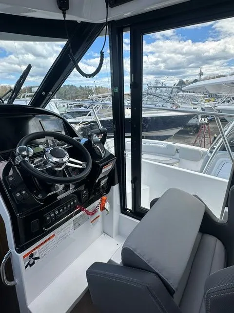 Slide: The Image of Interior view of 2021 Jeanneau NC 895 boat with helm station. - 13