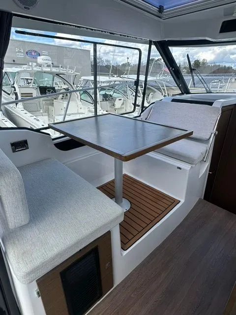 Slide: The Image of Interior of 2021 Jeanneau NC 895 yacht with seating area and table. - 15