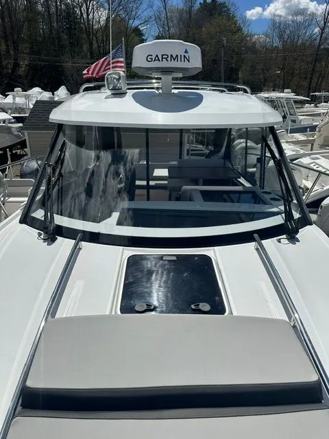 Slide: The Image of 2021 Jeanneau NC 895 with Garmin equipment, front view. - 25