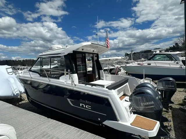Slide: The Image of 2021 Jeanneau NC 895 boat docked with Yamaha engines. - 3