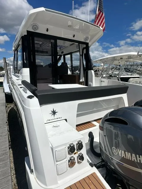 Slide: The Image of 2021 Jeanneau NC 895 boat with Yamaha engine at dock. - 5
