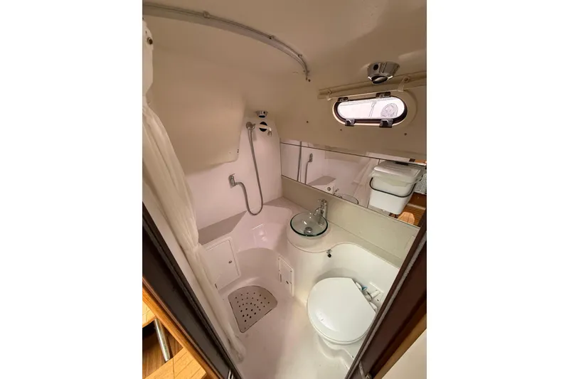 Slide: The Image of Bathroom interior of a 2012 Catalina 355 sailboat with shower and toilet. - 14