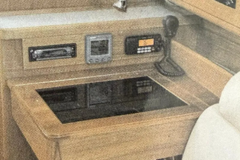 Slide: The Image of Navigation station of a 2011 Catalina 355 yacht with communication equipment. - 16