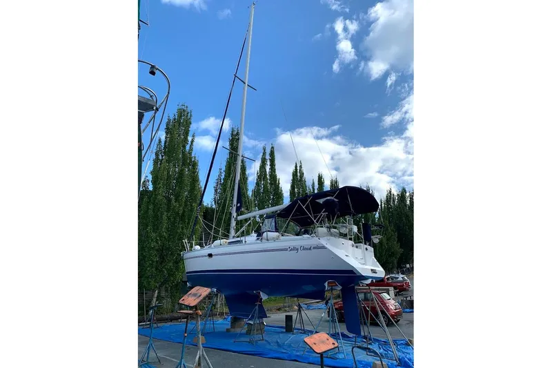 Slide: The Image of 2012 Catalina 355 sailboat on stands, under a clear blue sky. - 23