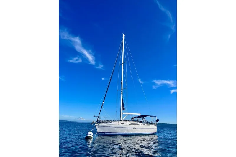 Slide: The Image of Sailboat Catalina 355 (2012) on calm blue water under clear sky. - 4