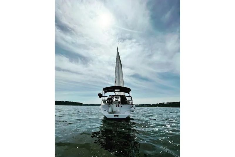 Slide: The Image of Sailing yacht Catalina 355 (2012) on open water under a cloudy sky. - 5