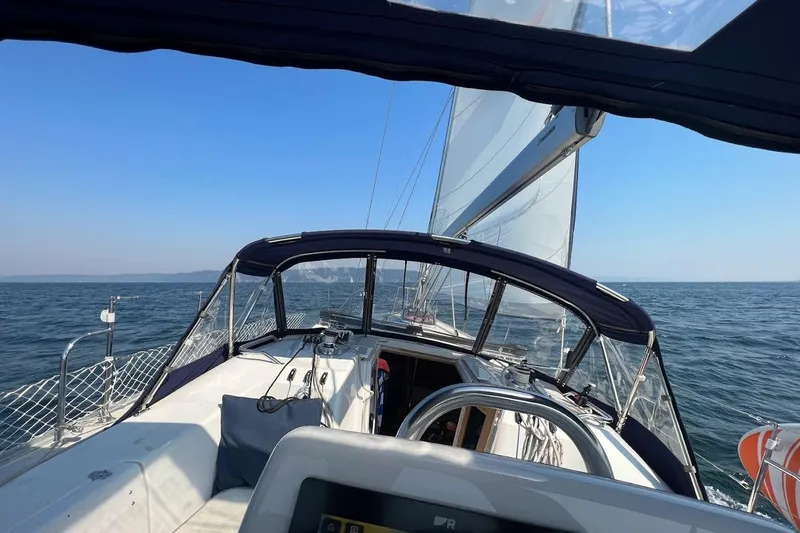 Slide: The Image of Sailing on a 2012 Catalina 355 yacht with clear blue skies and calm sea. - 6