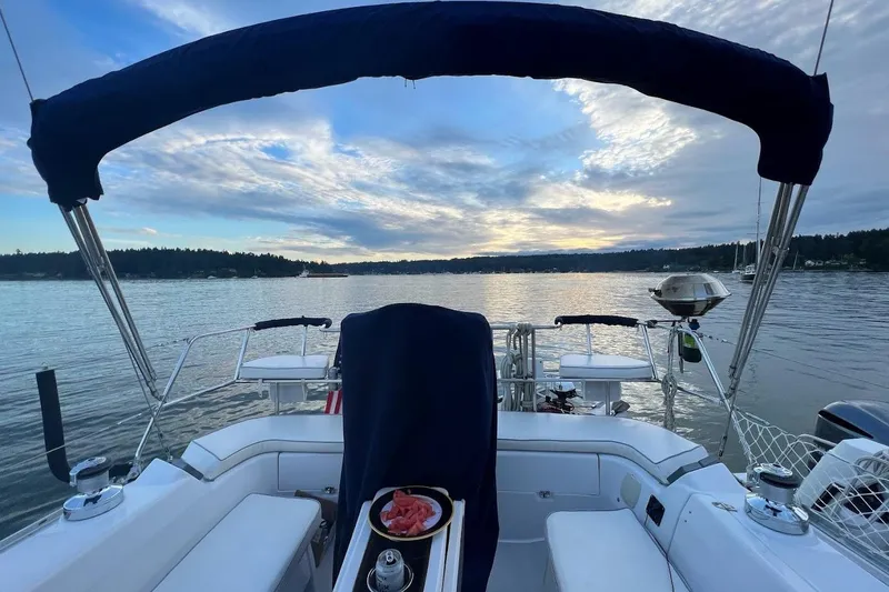Slide: The Image of Sailing on a 2012 Catalina 355 yacht at sunset, with serene waters and scenic views. - 8