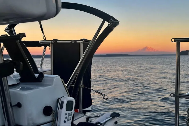 Slide: The Image of Sailboat Catalina 355 at sunset on the water, distant mountain view, 2012 model. - 9