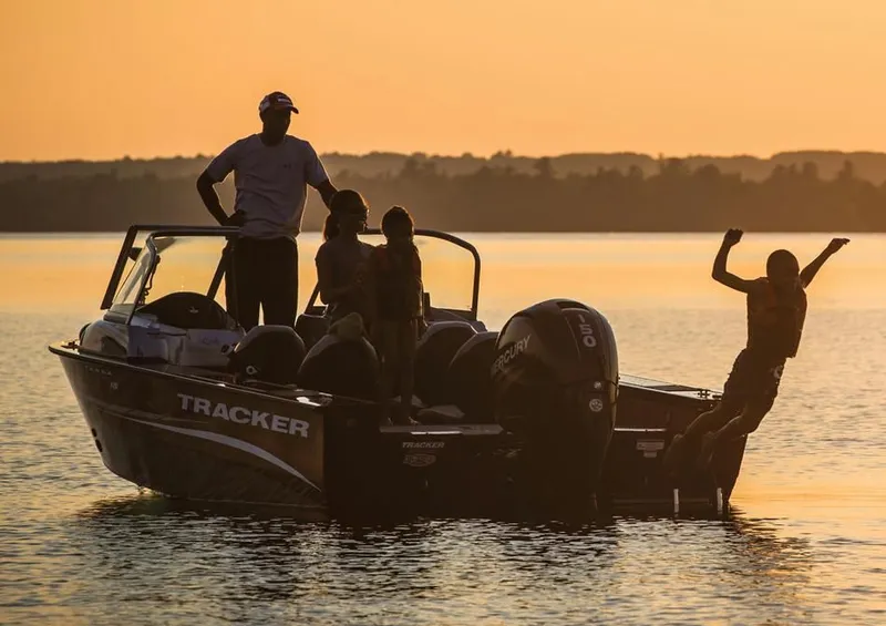 Slide: The Image of Family enjoying sunset on Tracker Targa V-18 Combo boat. - 11