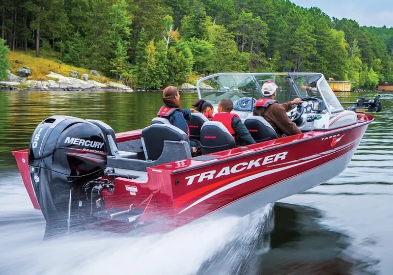 Slide: The Image of 2014 Tracker Targa V-18 Combo boat on a lake. - 12