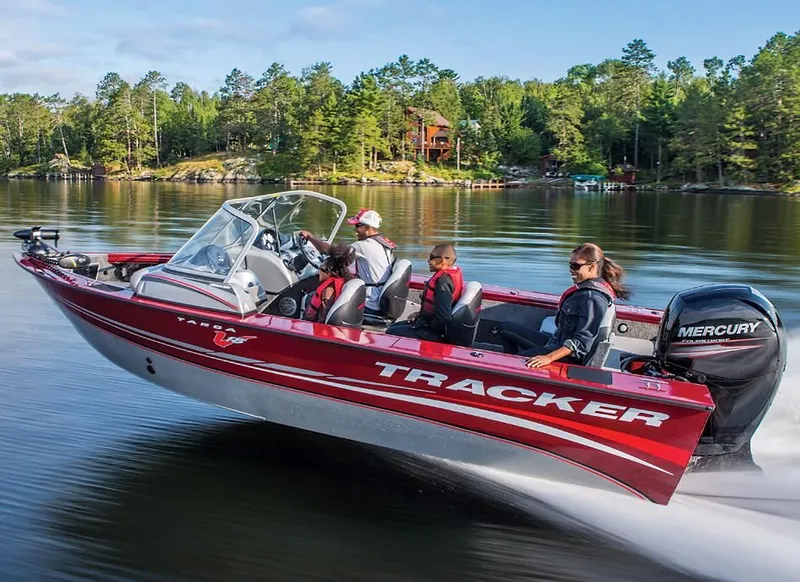 Slide: The Image of 2014 Tracker Targa V-18 Combo boat on a lake. - 13