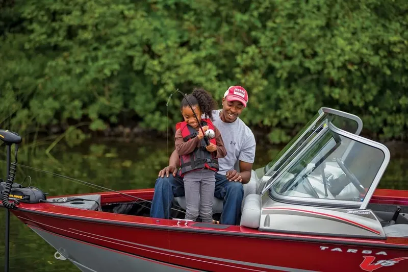 Slide: The Image of Family fishing on Tracker Targa V-18 Combo boat, 2014. - 14