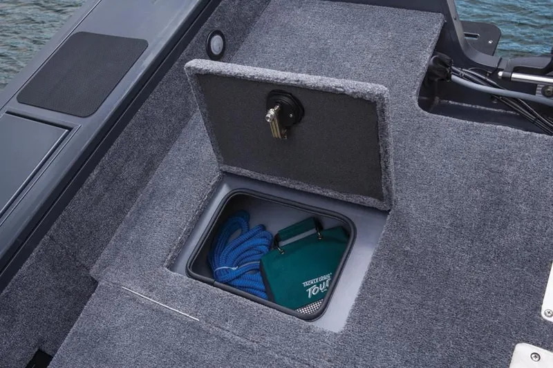 Slide: The Image of 2014 Tracker Targa V-18 Combo boat with storage compartment and accessories. - 17