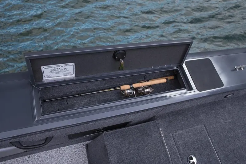 Slide: The Image of 2014 Tracker Targa V-18 Combo boat with fishing rod compartment. - 18