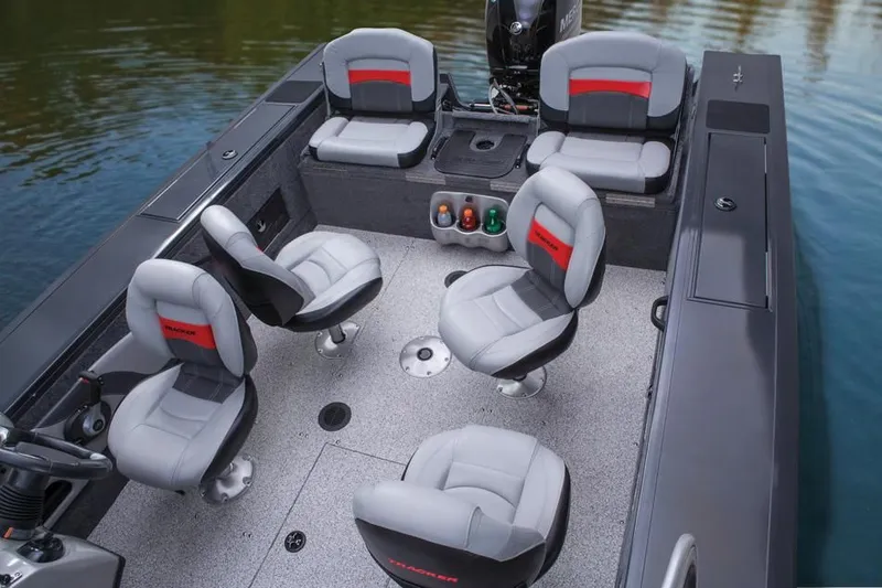 Slide: The Image of Interior of a 2014 Tracker Targa V-18 Combo boat with gray seating. - 21