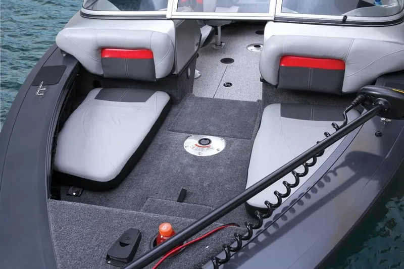 Slide: The Image of Interior of a 2014 Tracker Targa V-18 Combo boat with gray seating. - 30