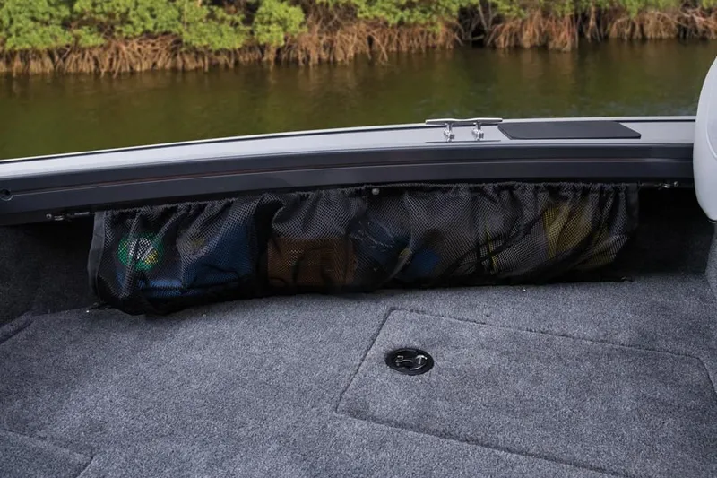 Slide: The Image of 2014 Tracker Targa V-18 Combo boat storage area by the water. - 34