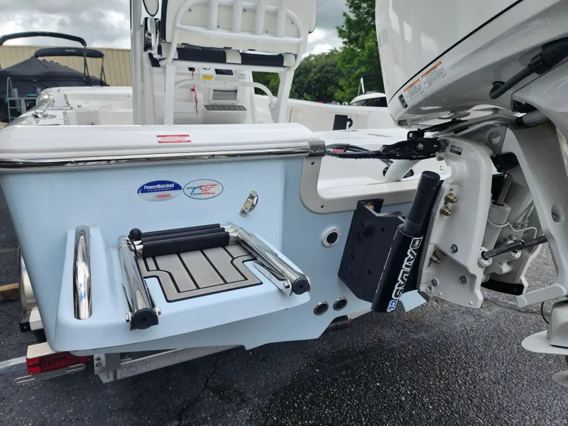 Slide: The Image of Rear view of a 2026 Tidewater 2210 Carolina Bay boat with Yamaha engine. - 11