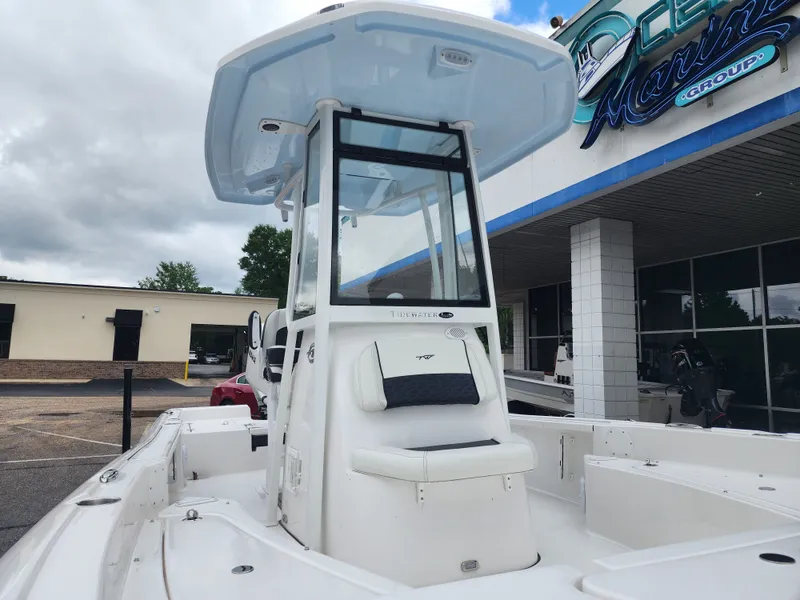 Slide: The Image of 2026 Tidewater 2210 Carolina Bay boat in front of a building. - 6