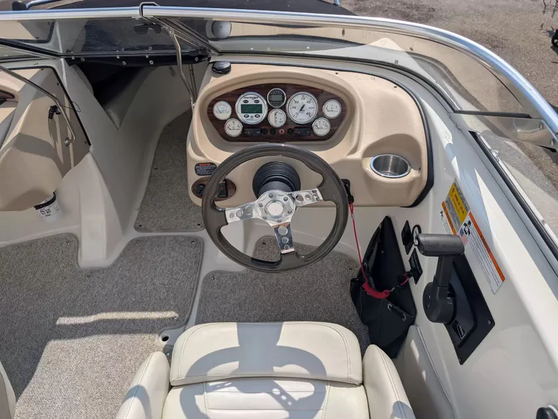 Slide: The Image of Interior view of 2008 Glastron GT 205 boat cockpit with steering wheel and gauges. - 10