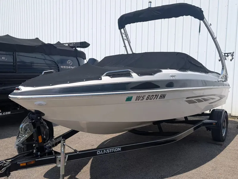 Slide: The Image of 2008 Glastron GT 205 boat on trailer, covered. - 6