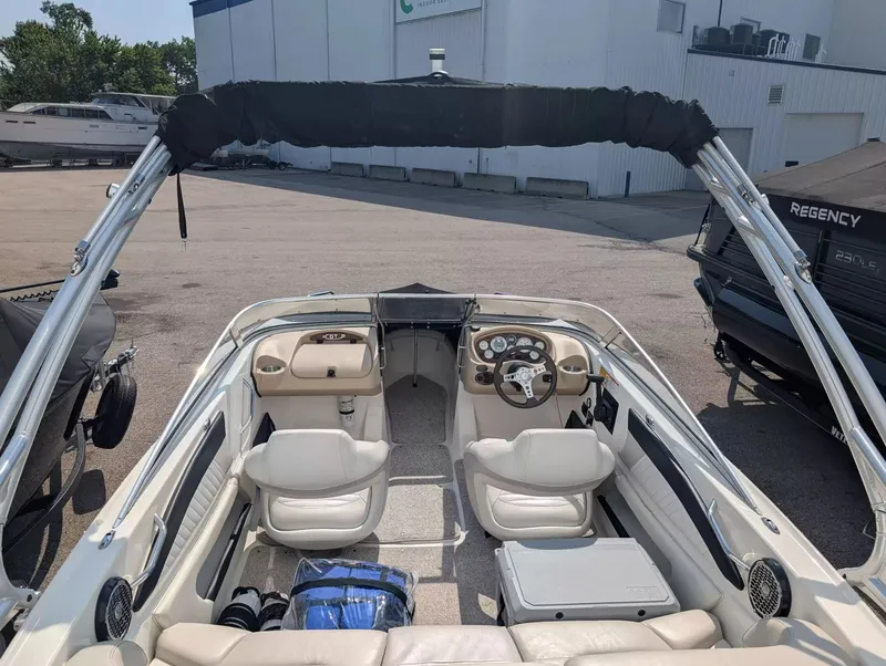 Slide: The Image of Interior of a 2008 Glastron GT 205 boat with steering wheel and seats. - 8