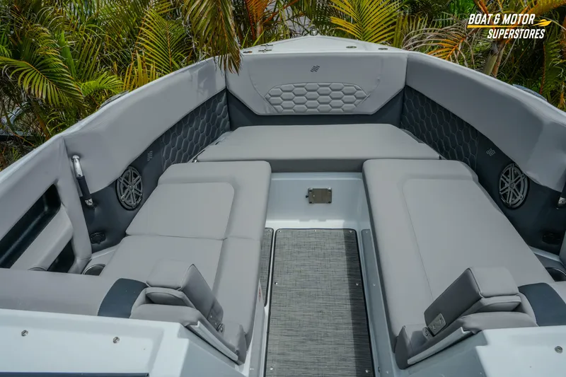 Slide: The Image of 2026 Four Winns H9 OB boat interior with gray seating and modern design. - 11
