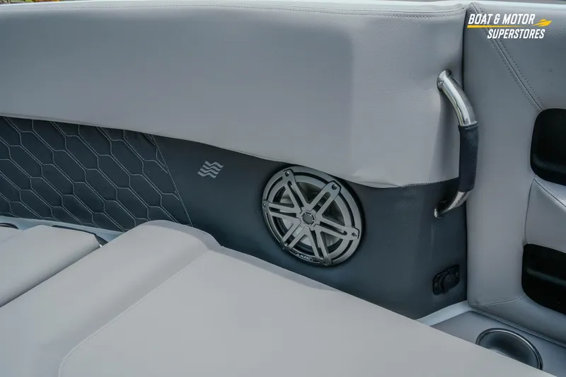 Slide: The Image of 2026 Four Winns H9 OB boat interior with speaker and sleek upholstery design. - 12