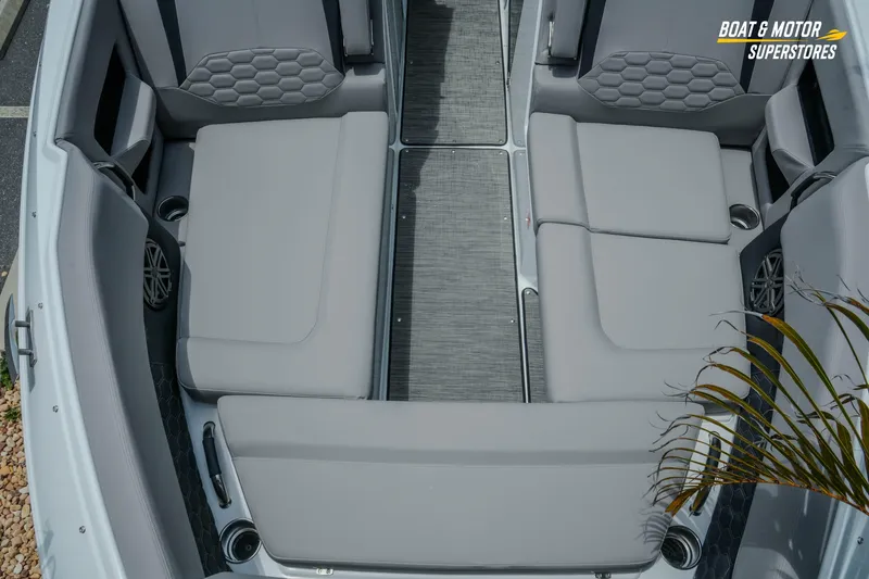 Slide: The Image of 2026 Four Winns H9 OB boat interior with gray seating and modern design. - 14