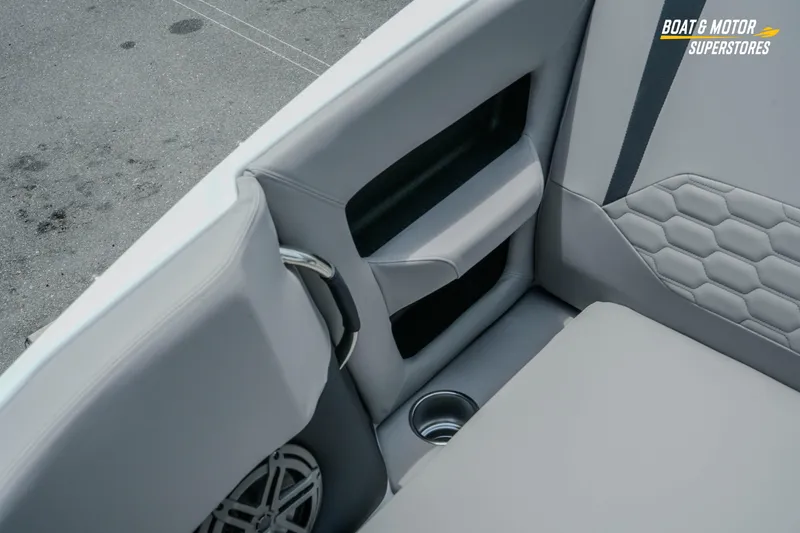 Slide: The Image of Interior seating of 2026 Four Winns H9 OB boat with cup holder and speaker. - 18