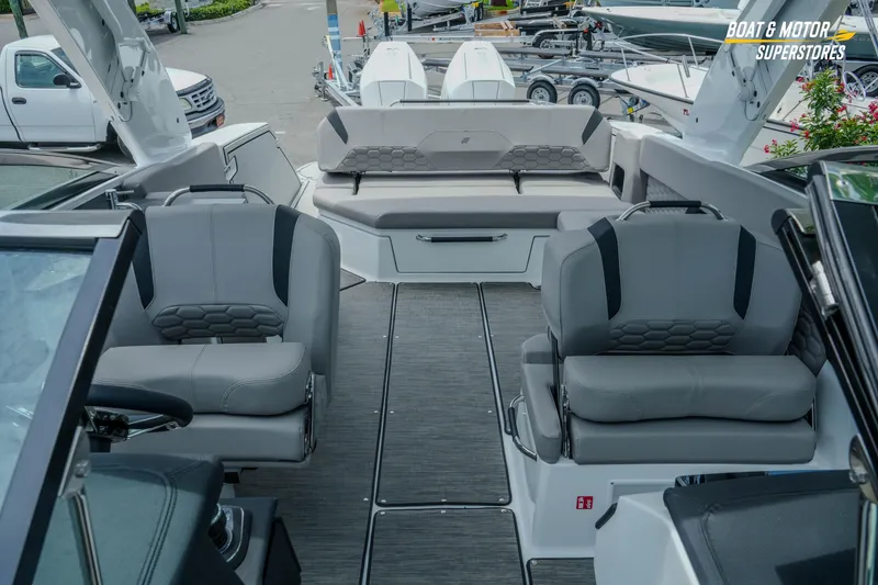 Slide: The Image of Interior view of 2026 Four Winns H9 OB boat with luxurious seating and modern design. - 19