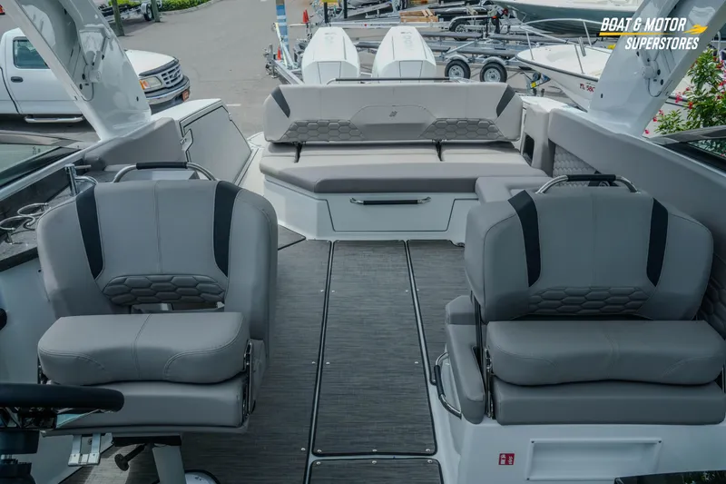Slide: The Image of 2026 Four Winns H9 OB boat interior with gray seating and modern design. - 20