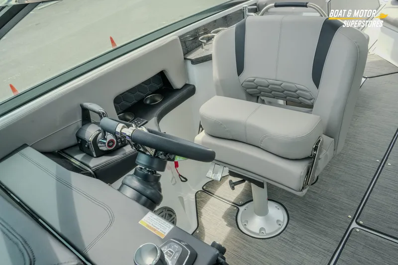 Slide: The Image of 2026 Four Winns H9 OB boat cockpit with modern steering and comfortable seating. - 21